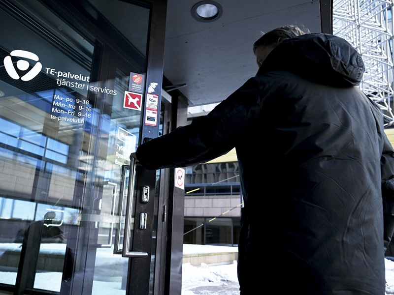 A client entering a TE Office in Helsinki in March 2023.