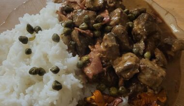 Moose calf liver stewed in cream with bacon and some cognac, served with rice, butterfried chanterelle mushrooms, and some capers.