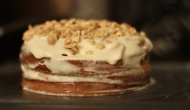 Simple homemade cake: lemon sponge, condensed milk cream and salted peanuts.