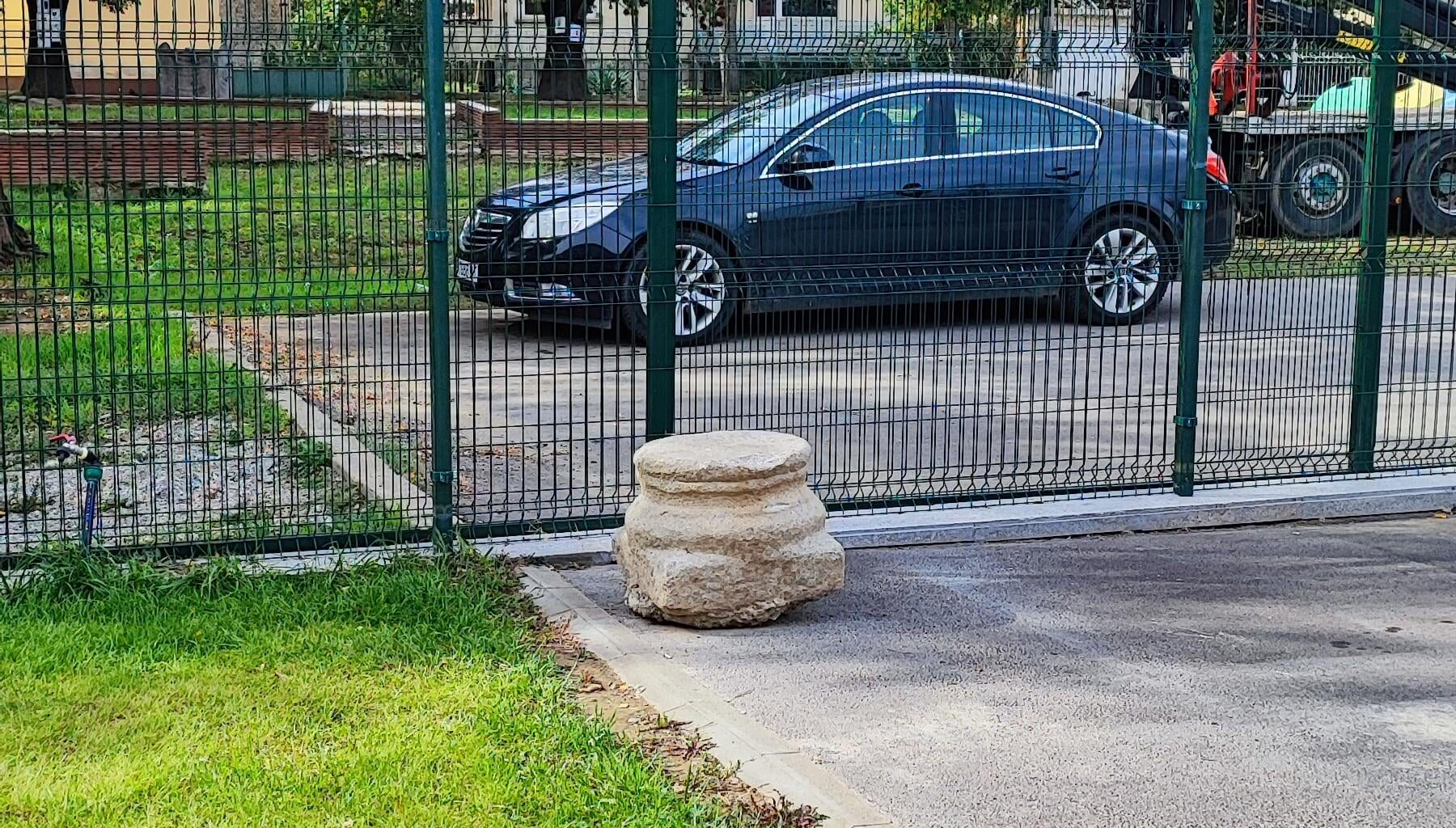 Ancient greek column base in a parking lot in Bulgaria