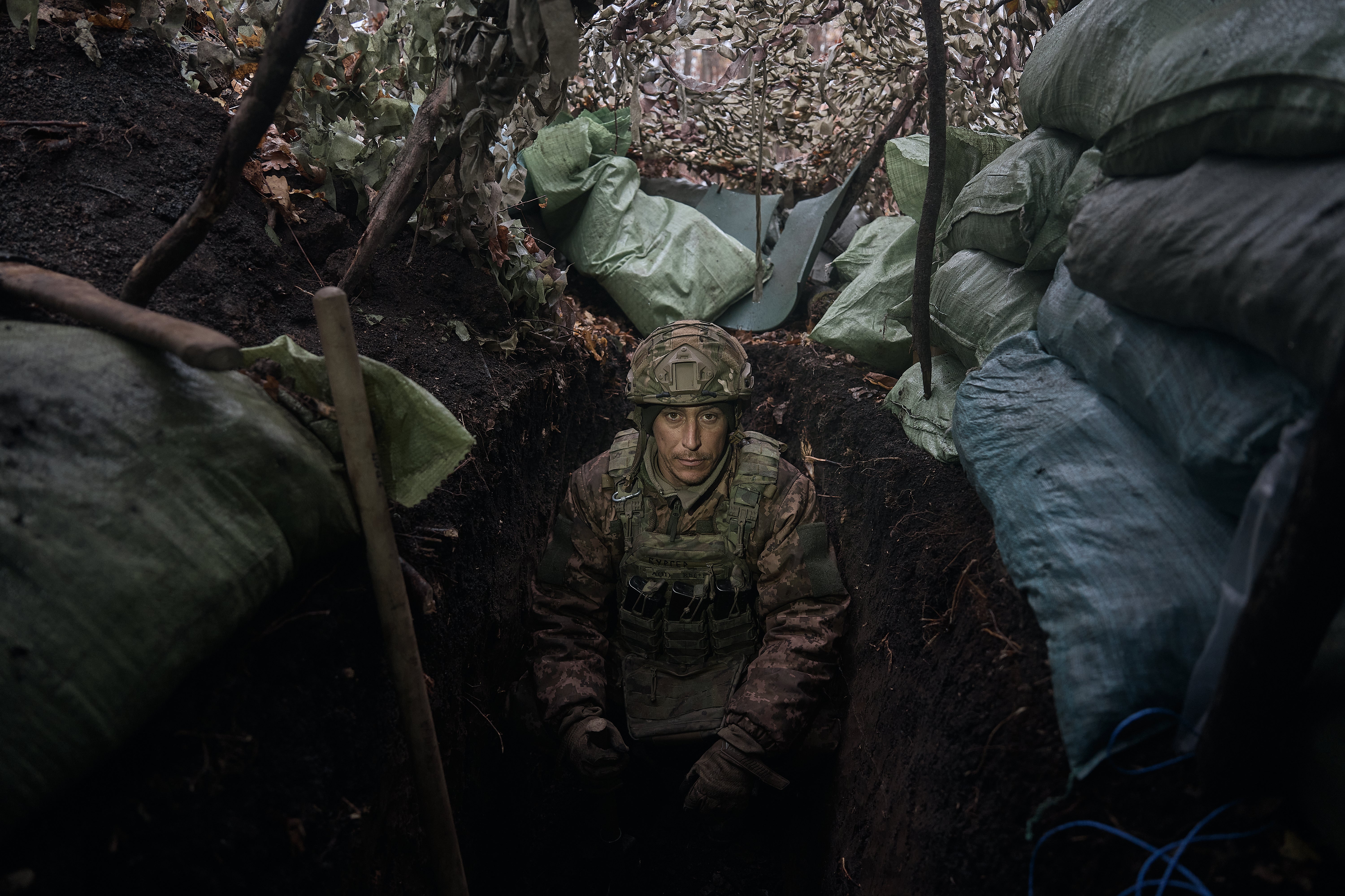 A soldier in a trench 100 meters from the Russian positions in the Serebryansky forest