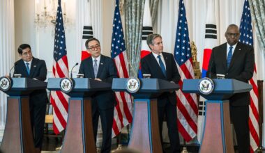 Secretary of Defense Lloyd J. Austin III, Secretary of State Antony J. Blinken and their South Korean counterparts stand at four lecterns.