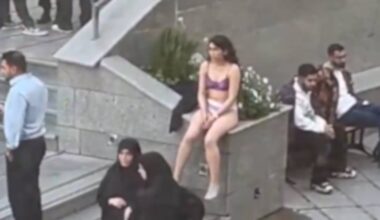 Iranian student strips in protest against assault by hijab enforcers.