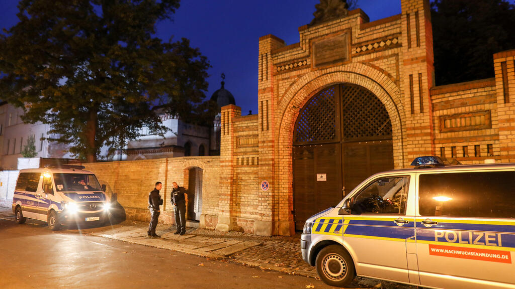 German police officers stand in front of the synagogue in Halle attacked by a heavily armed perpetrator on Yom Kippur, Oct. 9, 2019 