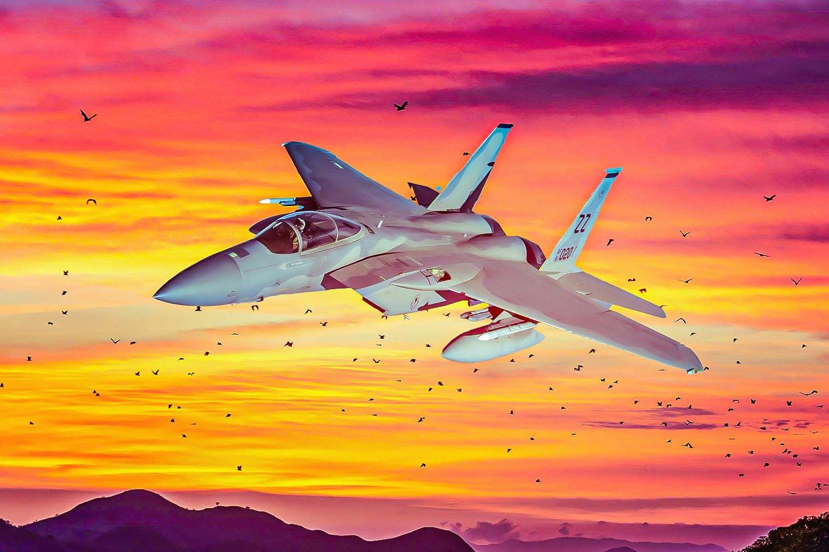 F-15 flying with sunset in the background.