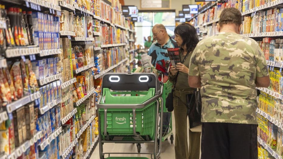 Consumers in a grocery store aisle