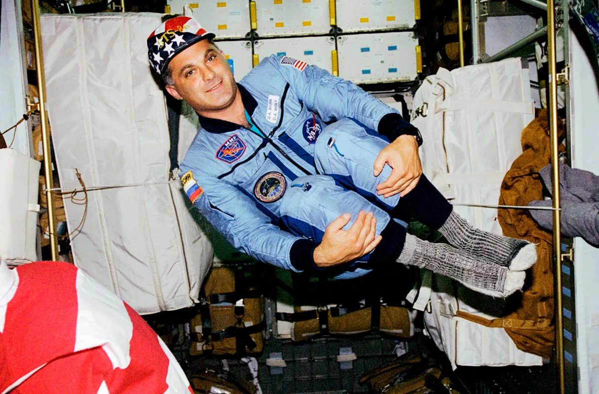 Astronaut David Wolf floating space.