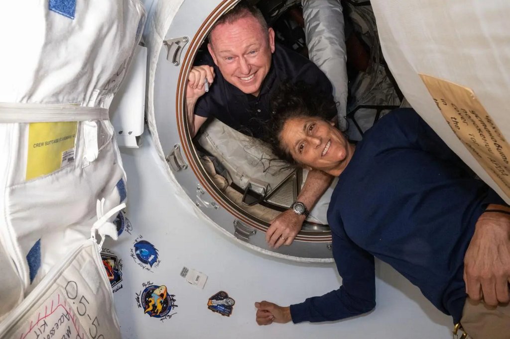 Astronauts Sunita Williams and Barry E. Wilmore in the International Space Station, preparing to vote in the U.S. election through an encrypted system.